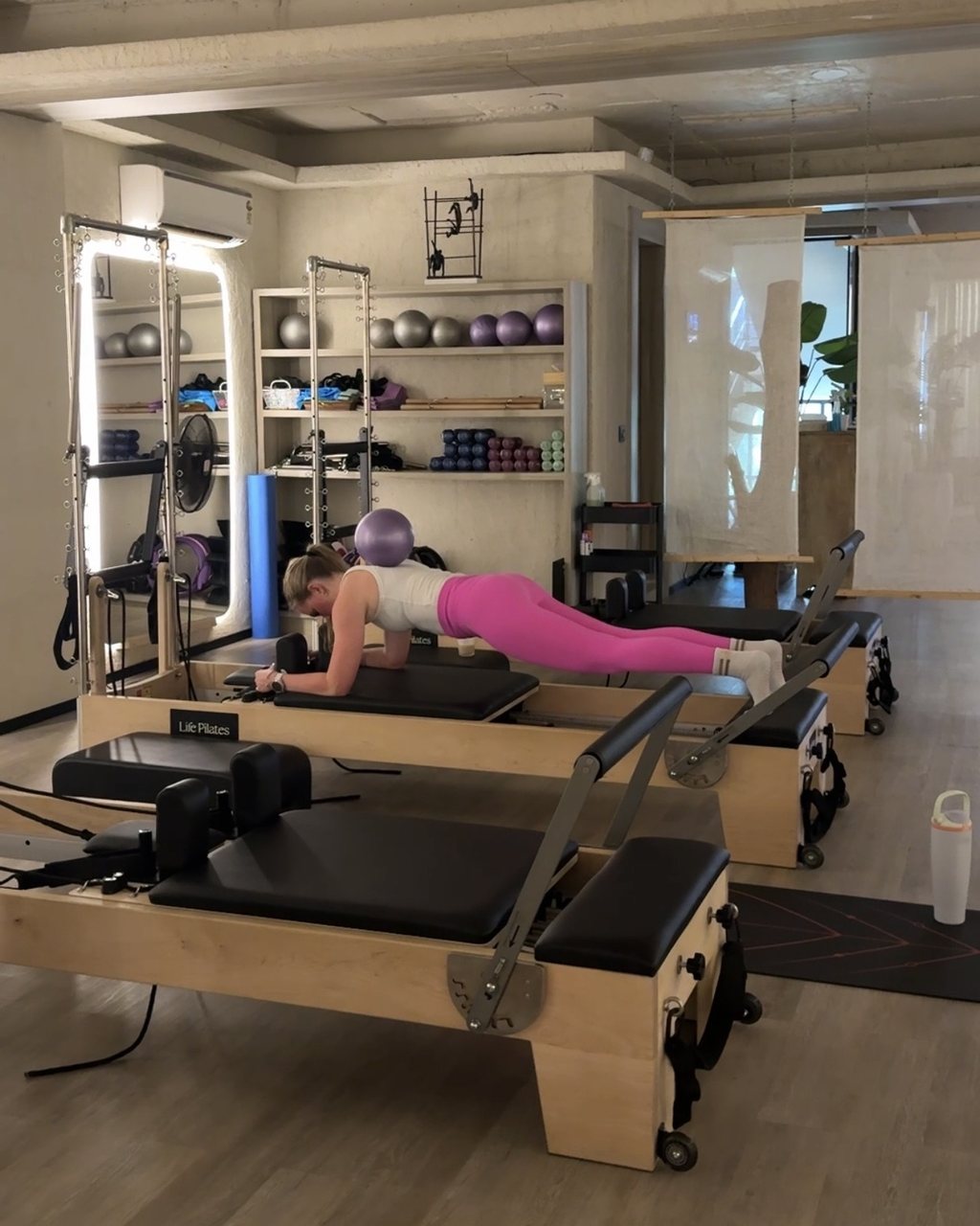A member working on the reformer at Life Pilates Chattarpur